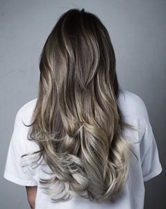 Woman with long grey ombre hair